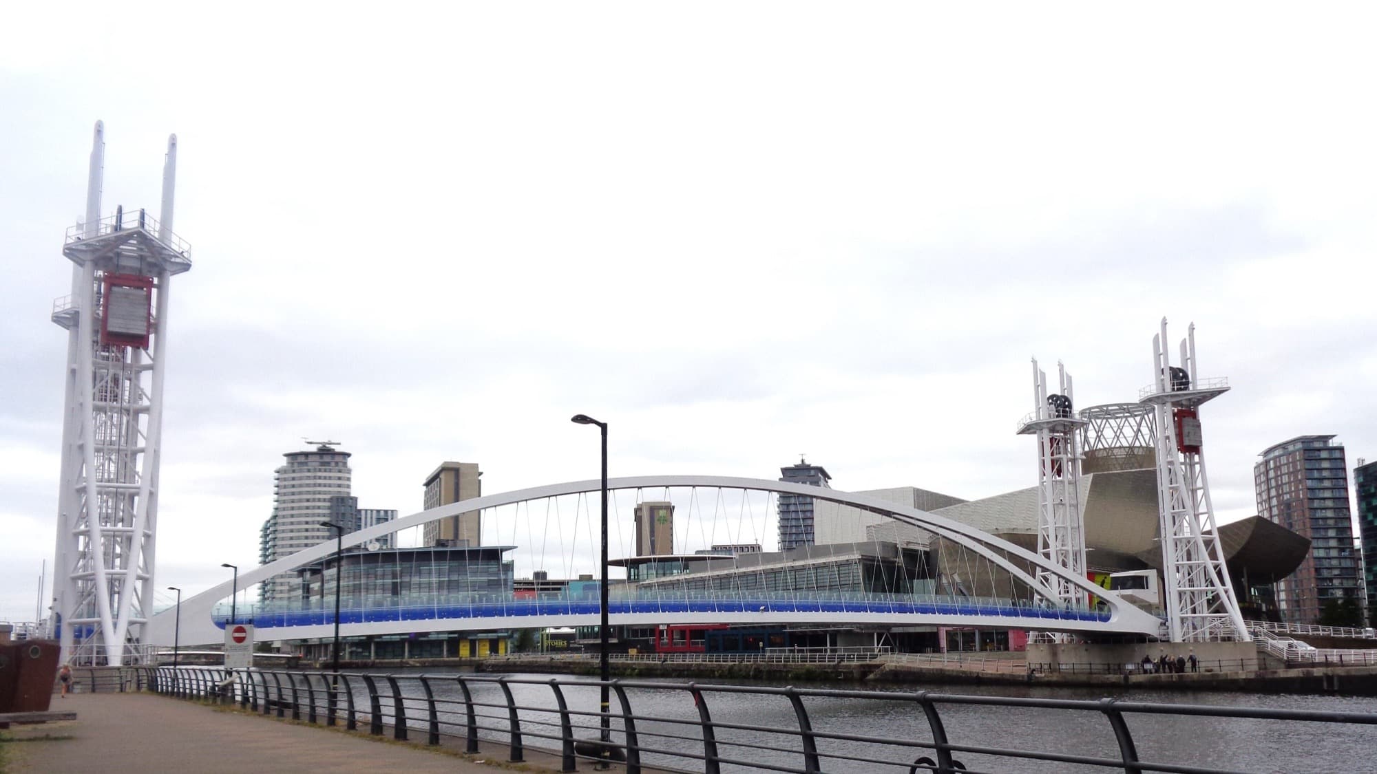 The Millennium Bridge at Salford Quays, with the waterfront and city beyond